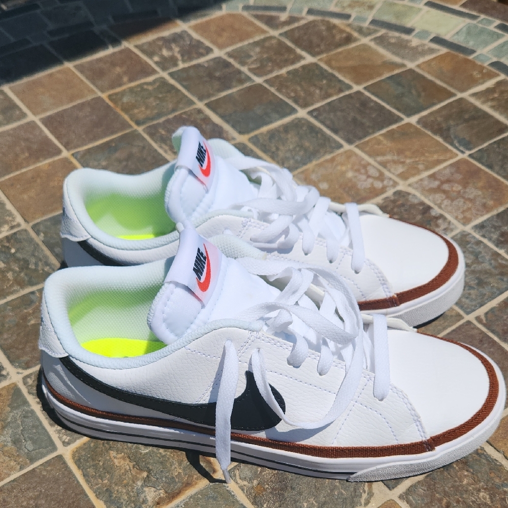Women's Nike White Sneakers with Black Swoosh and Brown Accents